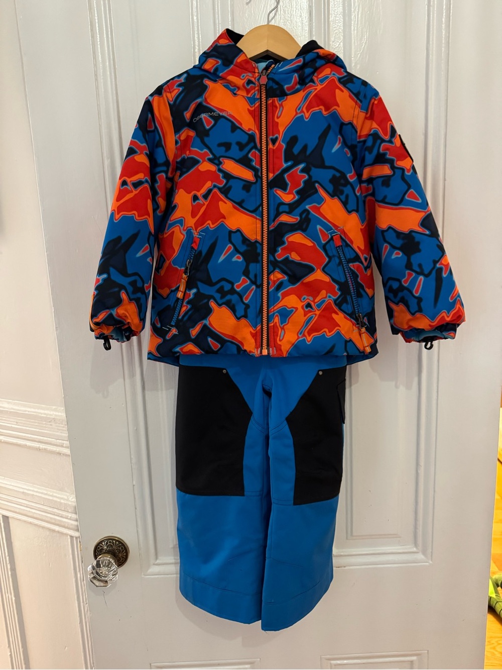 Obermeyer Orange, Blue & Black Camo Hooded Ski Jacket with Blue Pants